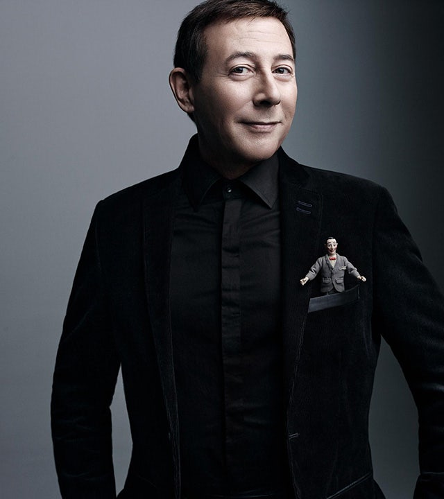 Paul Reubens in a black suit in photo released for his death